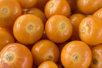 Top view of some fresh and bright cape gooseberry in basket