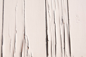 wooden background with old white paint. The old wall