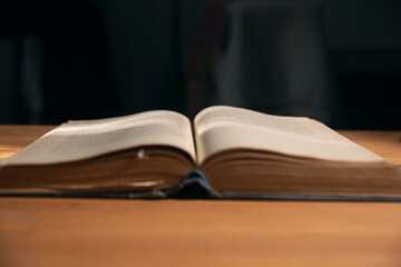 open book on the table black background