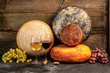 Whole round Head of parmesan or parmigiano hard cheese and wine on a wooden background. farmer market. place for text
