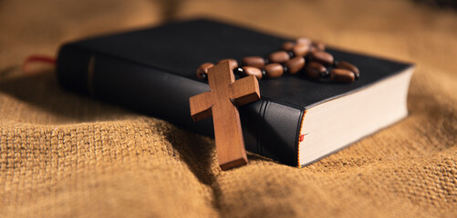 Holy Bible and Cross on Desk