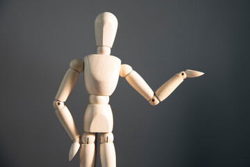 wooden mannequin black background