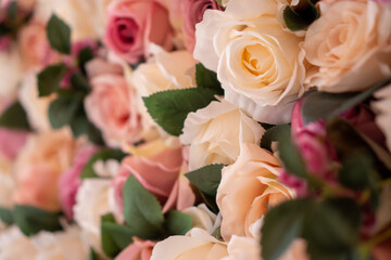 Closeup image of flowers wall background with pink and white roses. 