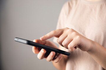 women holding a phone and bank cart