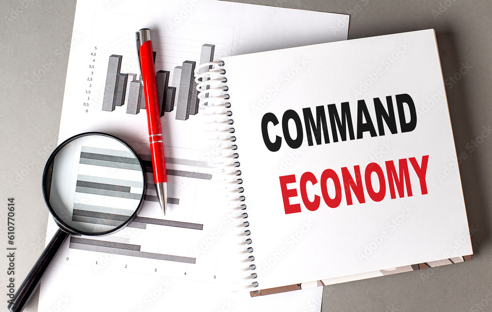 Aufkleber command economy text written on notebook with chart