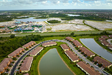 Aerial view of real estate development with tightly located family houses under construction in...