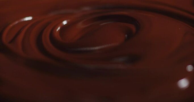 Chocolate texture. Liquid chocolate close-up.Textured dark chocolate.