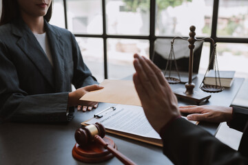 Lawyer or legal adviser, businessman refusing money coming with paper envelope Anti-bribery...