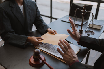 Lawyer or legal adviser, businessman refusing money coming with paper envelope Anti-bribery...