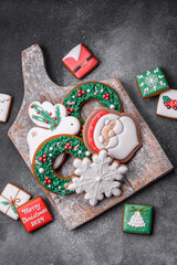 Beautiful colored Christmas gingerbread cookies for the design and decoration