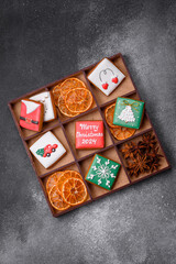 Beautiful colored Christmas gingerbread cookies for the design and decoration