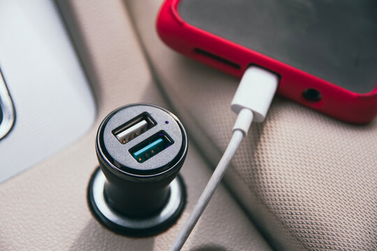 car charger for phone plugged into cigarette lighter