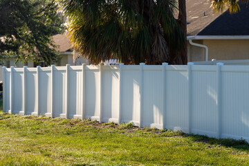 White plastic fence for back yard protection and privacy