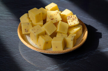 Cheese collection, matured yellow cow cheese with mustard seeds from Belgium