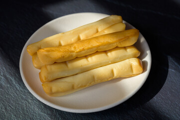 Cheese collection, Italian yellow smoked caciocavallo or scamorza cheese sticks from Puglia
