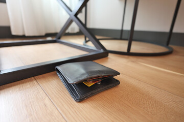  left wallet on floor at home 
