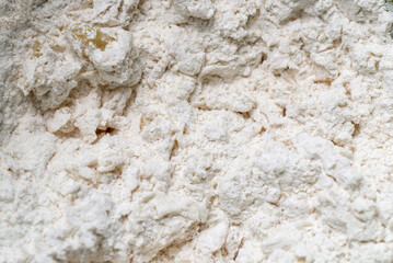 Mixture of flour and water. Preparation, kneading of dough for making bread. Macro close-up.