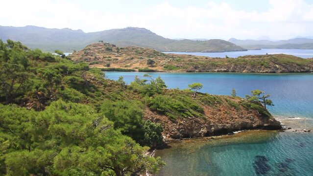 Beautiful indented sea coastline of Aegean Sea. High angle panoramic shot. Complex Aegean topography, characterized by numerous islands, straits, peninsulas and combination of shallow, deep basins
