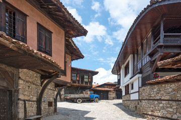 Fototapeta na wymiar Street and old houses in town of Koprivshtitsa, Bulgaria