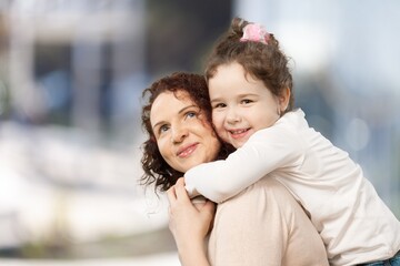 Happy young mother and cute child