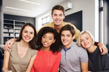 Group of happy university friends in class