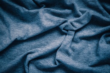 Wrinkled fabric texture. Close-up of soft cotton cloth, may be used as background.