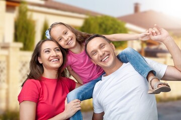 Happy young father and mother with child have fun