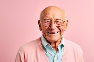 Obraz premium Medium shot portrait photography of a grinning man in his 80s that is wearing a chic cardigan against a pastel or soft colors background . Generative AI