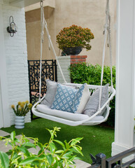 cozy porch swing hanging from a rope