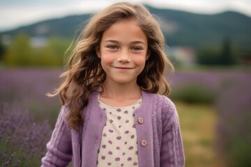 Portrait of a cute little girl in a lavender field.