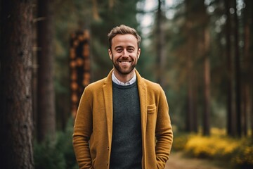 Medium shot portrait photography of a grinning man in his 30s that is wearing a chic cardigan against a mystical forest background .  Generative AI