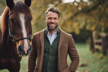 Medium shot portrait photography of a grinning man in his 30s that is wearing a chic cardigan against an equestrian or horse background .  Generative AI