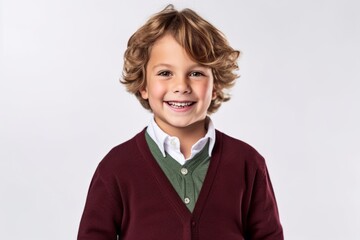Portrait of a cute little boy with curly hair on a white background