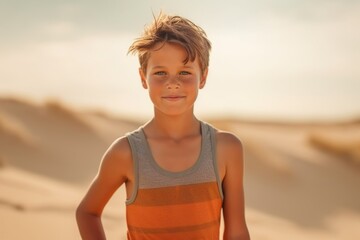 Portrait of a cute little boy in the desert at sunset.