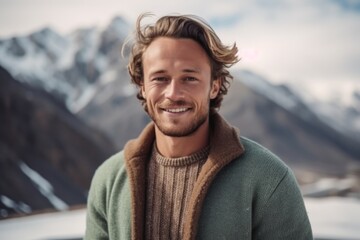 Medium shot portrait photography of a pleased man in his 20s that is wearing a chic cardigan against a snowy mountain peak or summit background .  Generative AI