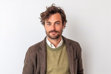 Obraz premium Medium shot portrait photography of a satisfied man in his 30s that is wearing a chic cardigan against a white background . Generative AI