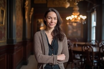 Medium shot portrait photography of a satisfied woman in her 30s that is wearing a chic cardigan against a victorian or historical interior background .  Generative AI