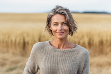 Medium shot portrait photography of a satisfied woman in her 40s that is wearing a cozy sweater against a field or meadow background .  Generative AI