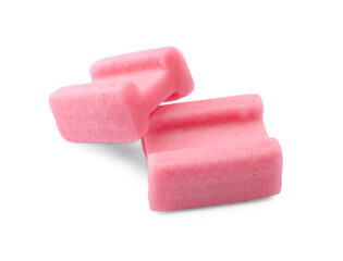 Tasty pink chewing gums on white background
