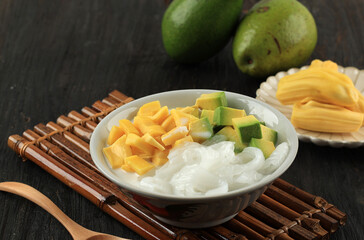 Avocado Coconut Jackfruit Ice Cocktail on Black Wooden Background,