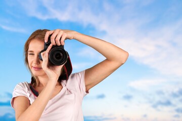 Happy young woman tourist in taking photo