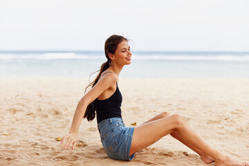 Fototapeta na wymiar attractive woman vacation sand smile beach sea nature sitting travel freedom
