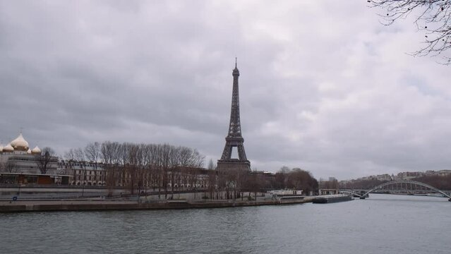 Eiffel Tower And Seine River On A Cloudy Day In Paris, France - wide