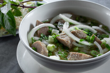 A view of a bowl of meatball pho, or pho bo vien.