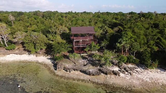 Close-up drone view of the G-Land tower on Plengkung Beach, the coastline in Java, Indonesia