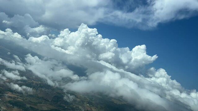 Awesome view from an airplane’s cabin during a left turn flying through some tiny cumulus. 4000m high, approacching to Palma de Mallorca’s airport. A pilot’s perspective.