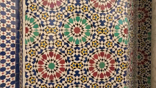 Oriental Moroccan tile pattern. Moroccan mosaic tiles. Colorful geometric symmetry, spiritual zen, beautiful architecture. Fez, Morocco.