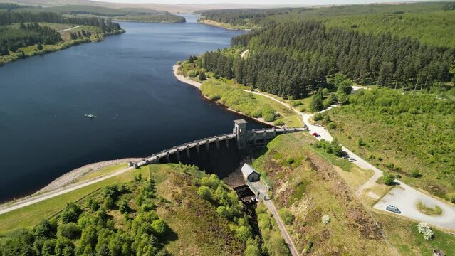 Alwen Reservoir dam Conwy, Wales - Aerial drone clockwise pan from far, focus on dam - June 23