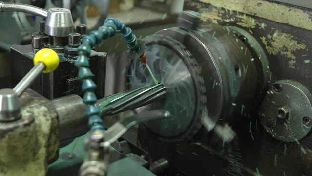 Engineering an alloy sprocket through a reaming process on a lathe machine with great precision.