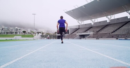 Back of man start running race for sports, action and speed on stadium, arena and competition. Male athlete, runner and ready to sprint for fitness, fast training and cardio performance at track line